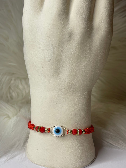 Big blue ojo red string